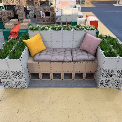 Green bench with plants in a park