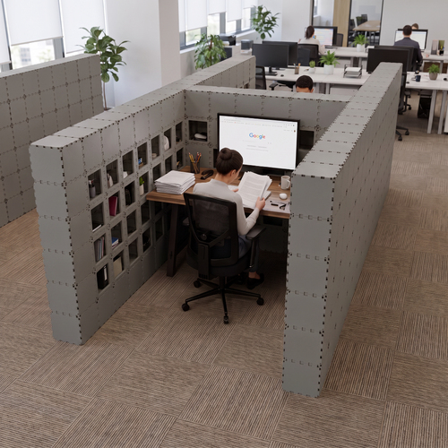 Grey Cubik H-2 workstation, person at a desk in an open office